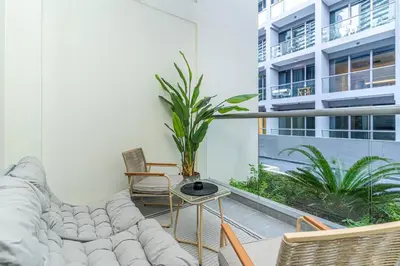 a living room with a couch and a table at Trendy Studio! Walk to Burj Khalifasleeps 3! in Dubai
