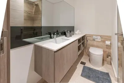 a bathroom with a sink and a toilet at Designer Glam Studio Steps from Burj Khalifa in Dubai