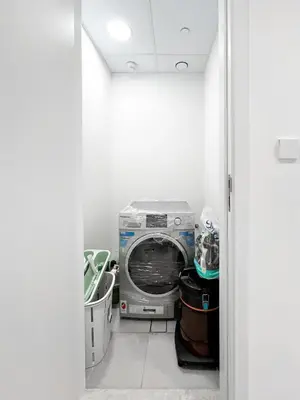 a laundry room with a washing machine in it at Spectacular 2BR Apartment Full BurjAlArab View in Dubai