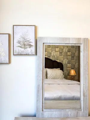 a bedroom with a bed with two pictures on the wall at Cozy Apartment with City Views Next to Burj Khalifa 166FO1-2 in Dubai