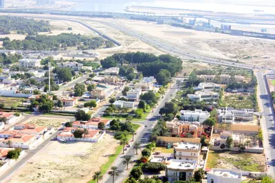 an aerial view of a small town with houses at RH- Live in Luxury, 01BR with spectacular view in Dubai