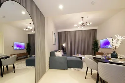 a living room with a couch and a table at RH- Live in Luxury, 01BR with spectacular view in Dubai