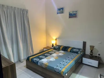 a bedroom with a bed in a room at Stylish 1bhk at silicon oasis in Dubai