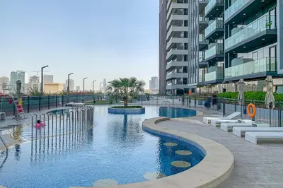 a swimming pool in the middle of a building at Frank Porter - Bloom Tower C in Dubai