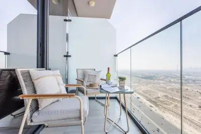 a balcony with a table and chairs and a view at Frank Porter - Bloom Tower C in Dubai