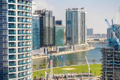 a view of a city with tall buildings and a river at Ahad Residences - City Retreat Apartments - Zed Living in Dubai