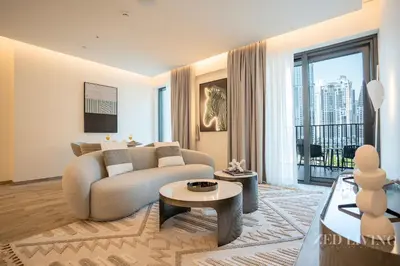 a living room with a couch and a table at Ahad Residences - City Retreat Apartments - Zed Living in Dubai