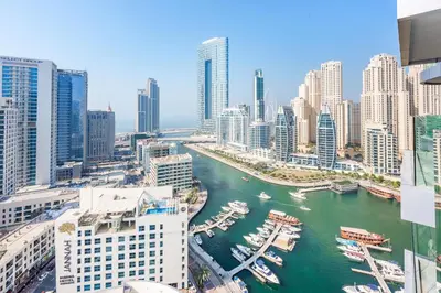 a view of a river in a city with buildings at Stayis -Luxurious 2BR Apartment with breathtaking ocean and Marina View in Dubai