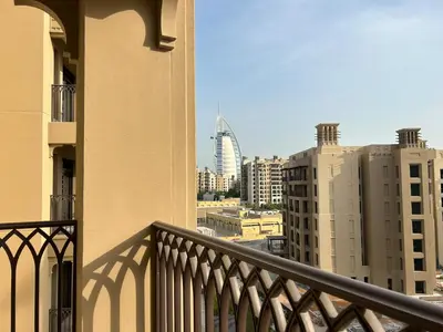 a balcony with a view of the city at StoneTree - Furnished 1BR in Madinat Jumeirah in Dubai