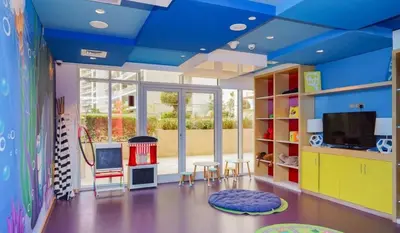 a childs room with a blue ceiling and a tv at Luxury Hotel Apartment - DownTown in Dubai