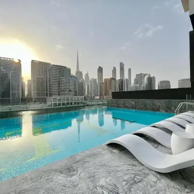 White and gold studio apartment in Binghatti Canal whit pool