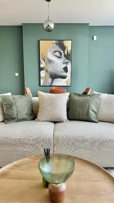 a living room with a couch and a table at LUXURY SPACIOUS - 1 BR - SKY GARDENS DIFC - Heart of Trade Centre and Dubai Mall in Dubai