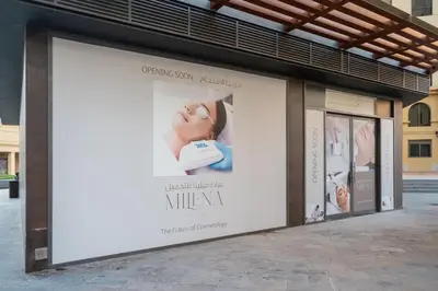 a large billboard on the side of a building at Cozy pad in the heart of Dubai on JBR beach! in Dubai