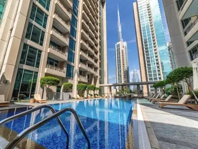 a swimming pool in the middle of a city with tall buildings at Golden Homes Boulverd Central 1BHK BLUE HEAVEN Near Dubai mall & burj khalifa Downtown Dubai in Dubai