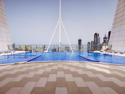 a view of a pool on top of a building at Full lake View 1bk Apartment in JLT 4 ppl early & late check in 10mn to Marina metro station in Dubai