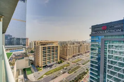 an aerial view of a city with buildings at Seven Palm 1 Bed with Rooftop Infinity Pool in Dubai