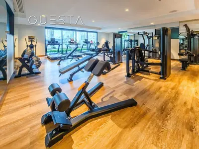 a gym with treadmills and exercise equipment in a building at Act One Act Two by Emaar, Downtown Dubai in Dubai