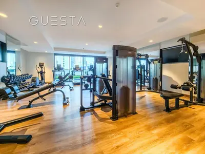 a gym with treadmills and cardio equipment in a building at Act One Act Two by Emaar, Downtown Dubai in Dubai