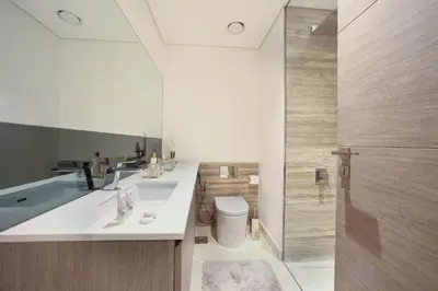 a bathroom with a sink and a toilet and a shower at Luxury Glam Studio Near Burj Khalifa Downtown in Dubai