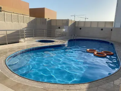 a large swimming pool on top of a building at Master Room with attach Bathroom Near Mall of the Emirates in Dubai