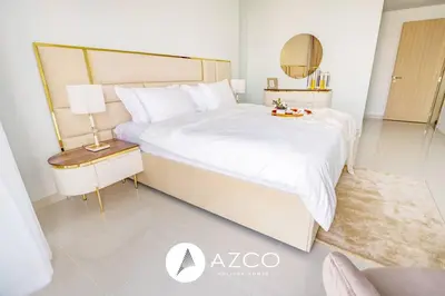 a bedroom with a large white bed and a mirror at 1BR Apartment in Paramount Midtown in Dubai