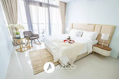 a bedroom with a large bed with a bowl on it at 1BR Apartment in Paramount Midtown in Dubai