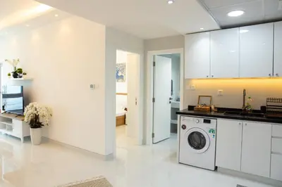 a white laundry room with a washer and dryer at Dubai Marina (Marina Diamond 2) 1 Bedroom Apt. in Dubai