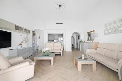 a living room with two couches and a tv at Seaview-Shoreline4-Palm Jumeirah in Dubai