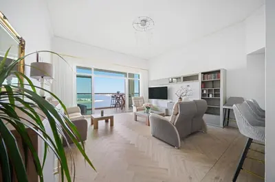 a living room with a view of the ocean at Seaview-Shoreline4-Palm Jumeirah in Dubai