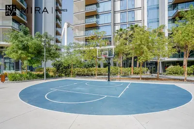 a basketball court in front of a building at Mira Holiday Homes - Luxury 1 bedroom in Bluewaters Island in Dubai