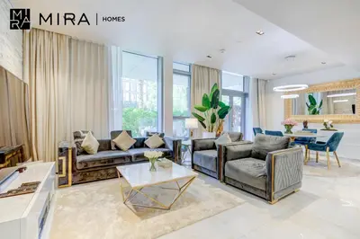 a living room with couches and a table at Mira Holiday Homes - Luxury 1 bedroom in Bluewaters Island in Dubai