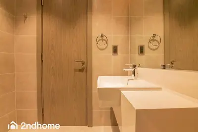 a bathroom with a sink and a shower at 2ndHome - District One Residences , Residence 14 in Dubai