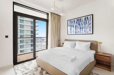 a bedroom with a large bed and a large window at Silkhaus Beach Lovers 1BDR with Marina View in Dubai