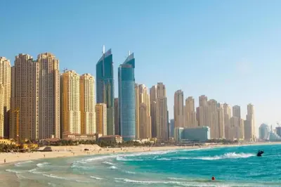 a view of a beach with tall buildings at JBR Retreat: Stylish Views in Dubai
