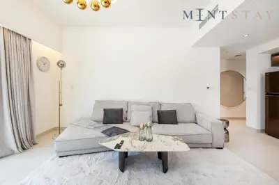 a living room with a couch and a table at Burj Crown , Downtown Dubai - Mint Stay in Dubai
