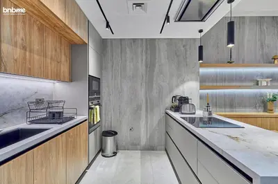 a kitchen with a sink and a counter top at bnbmehomes - Forte in Dubai