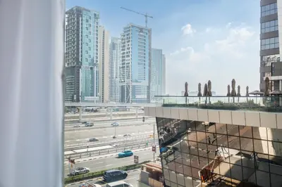a view from a window of a city with traffic at Trophy - Marina Urban Serenity Suite in Dubai