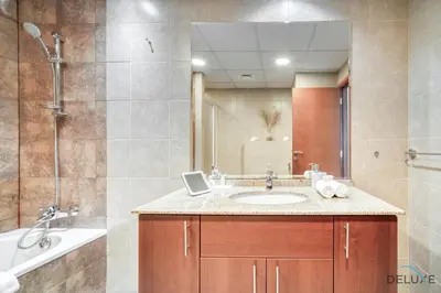 a bathroom with a sink and a shower at Colossal 2BR at MAG 218 Dubai Marina by Deluxe Holiday Homes in Dubai