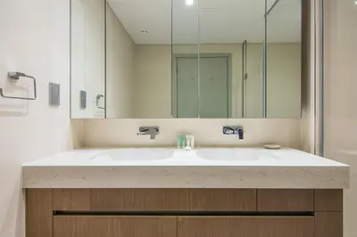 a bathroom with a sink and a mirror at Marvelous Apartment in Beachfront Private Beach in Dubai