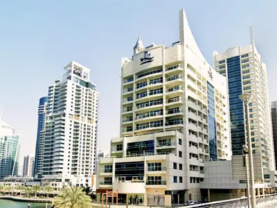 a group of tall buildings in a city at Full sea view with balcony - Studio Apartment - 10 min to JBR - in Dubai