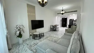 a living room with a couch and a tv at Stay in heart of Dubai Marina walk to JBR beach 8 in Dubai