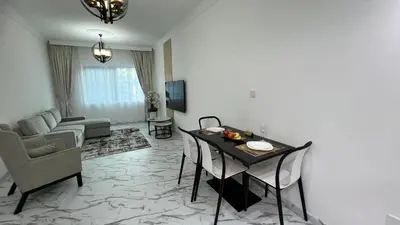 a living room with a table and chairs and a couch at Stay in heart of Dubai Marina walk to JBR beach 8 in Dubai