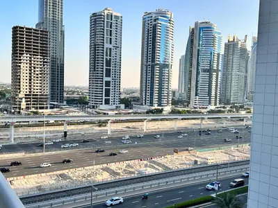 a view of a highway in a city with tall buildings at Stay in heart of Dubai Marina walk to JBR beach 8 in Dubai