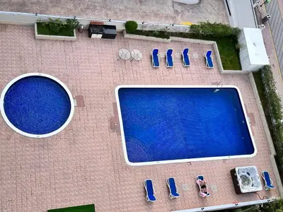 an overhead view of a swimming pool with parked cars at Stay in heart of Dubai Marina walk to JBR beach 8 in Dubai