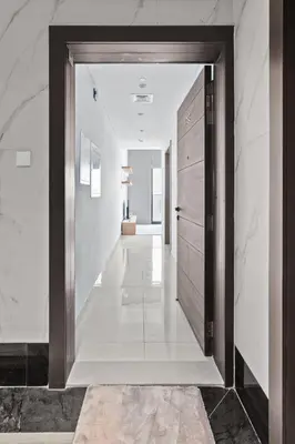 a hallway with a door leading to a living room at Studion In Dubailand - Close Kitchen in Dubai