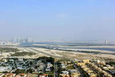 an aerial view of a city and the ocean at RH -Skyline Serenity, High-Floor Oasis in Downtown, walk to Burj Khalifa in Dubai