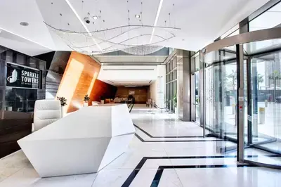 a lobby with a white table in a building at SettlerHomes - Sparkle Tower 2 with Stunning Views in Dubai