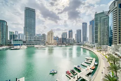 a river in a city with boats in the water at Elegant 2BR at Beauport XI Dubai Marina by Deluxe Holiday Homes in Dubai