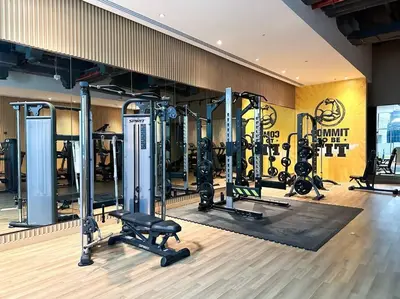 a gym with a lot of equipment in a room at Seaside 1BR Getaway - Seven Palm in Dubai