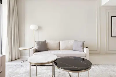 a living room with a couch and a table at Silkhaus Ultra Luxury 1BDR with Sea View in Dubai
